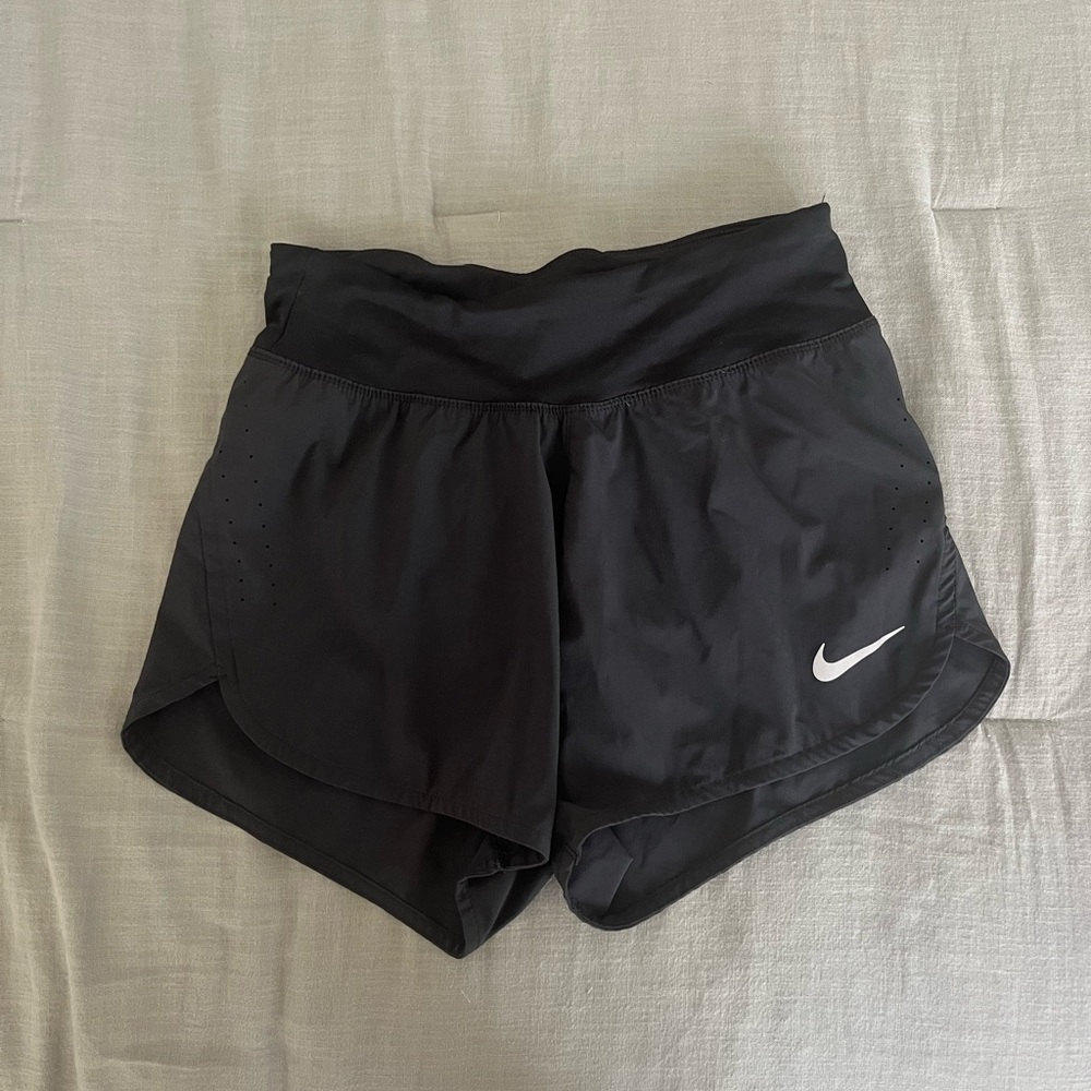 Black Nike running shorts